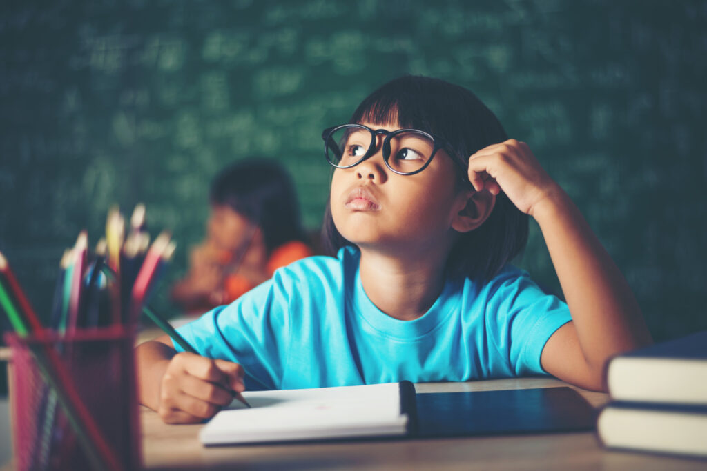 child is thinking about how to solve mean, median and mode