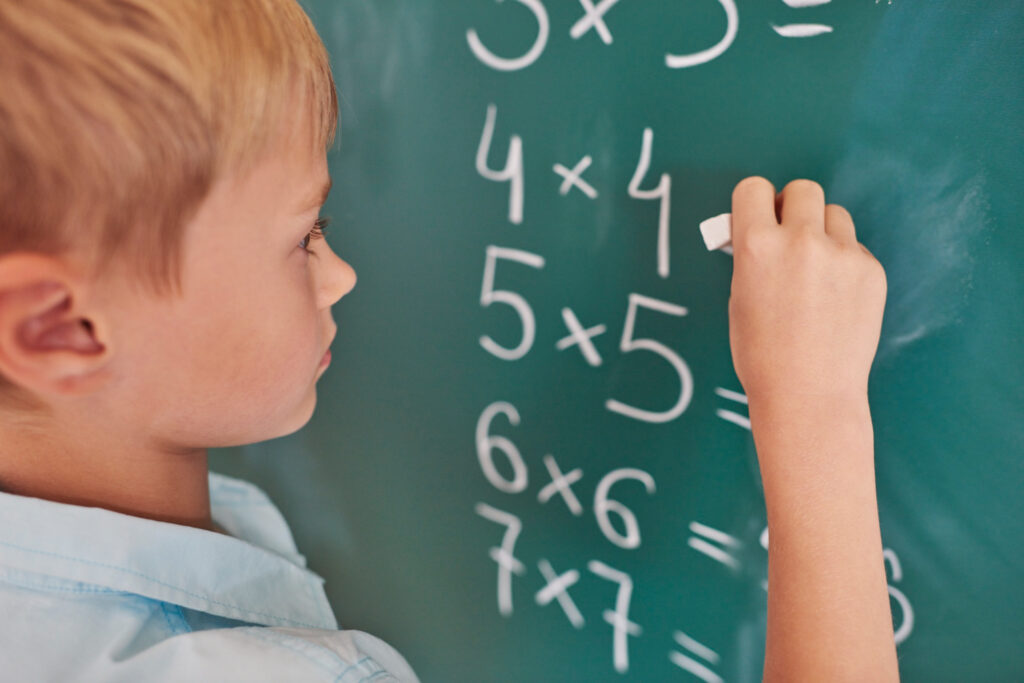 child solves math problems